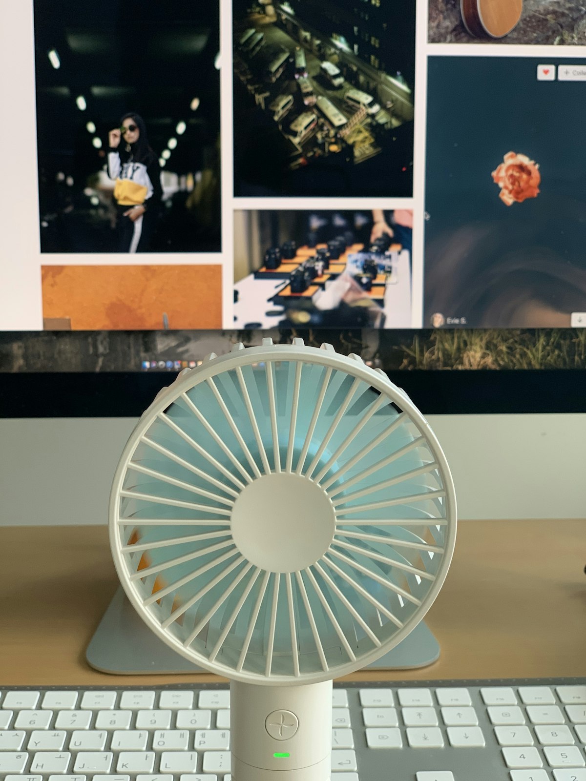 Small portable electric fan running on a table